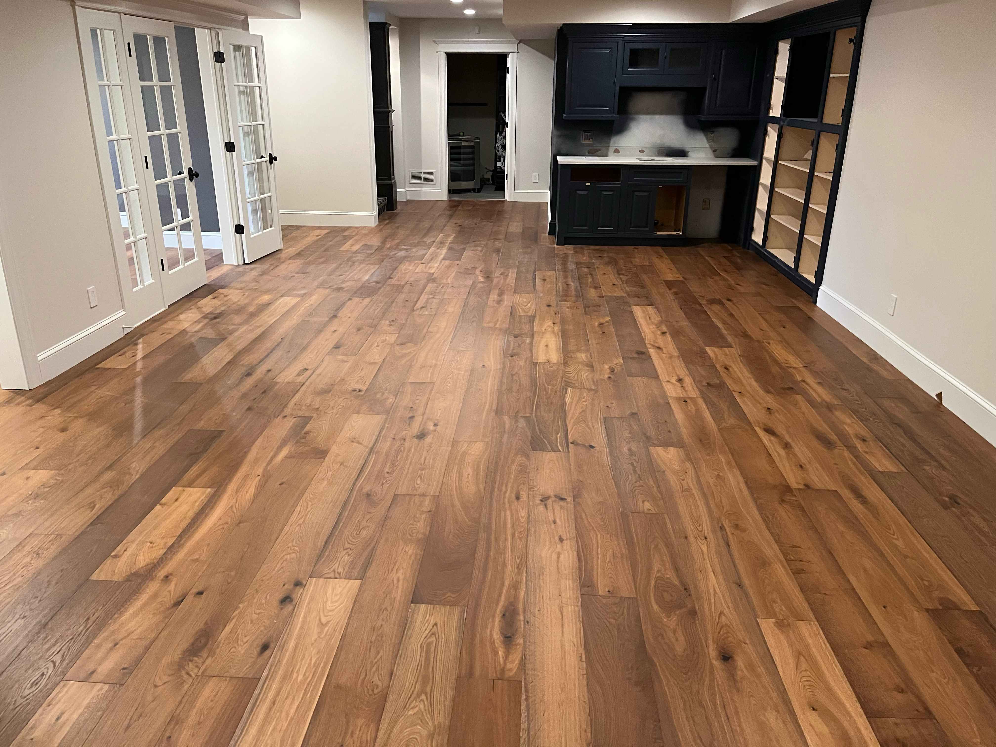 Beautiful hardwood flooring installation in a basement