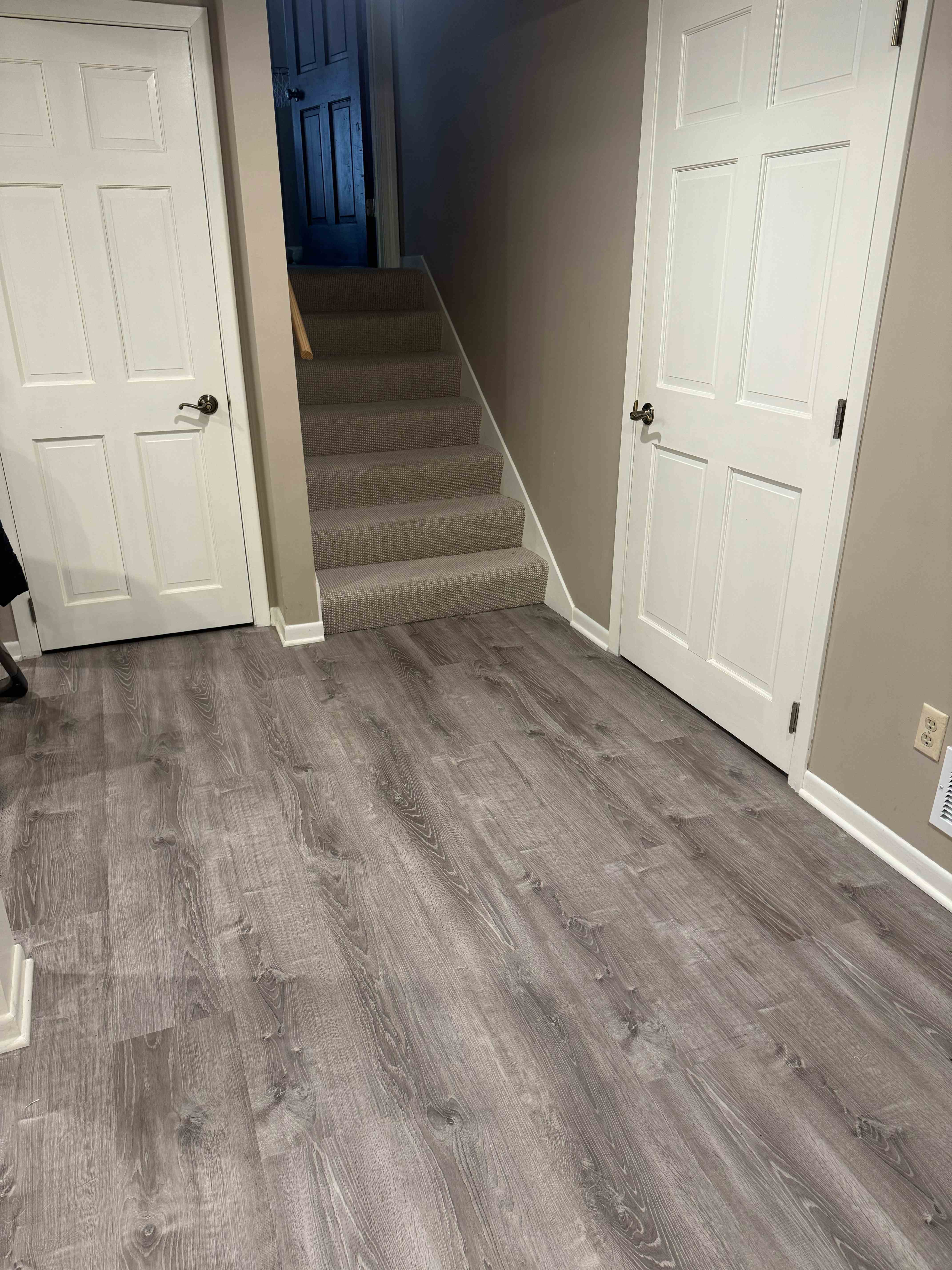 Hallway with custom trim work and doors featuring elegant white molding
